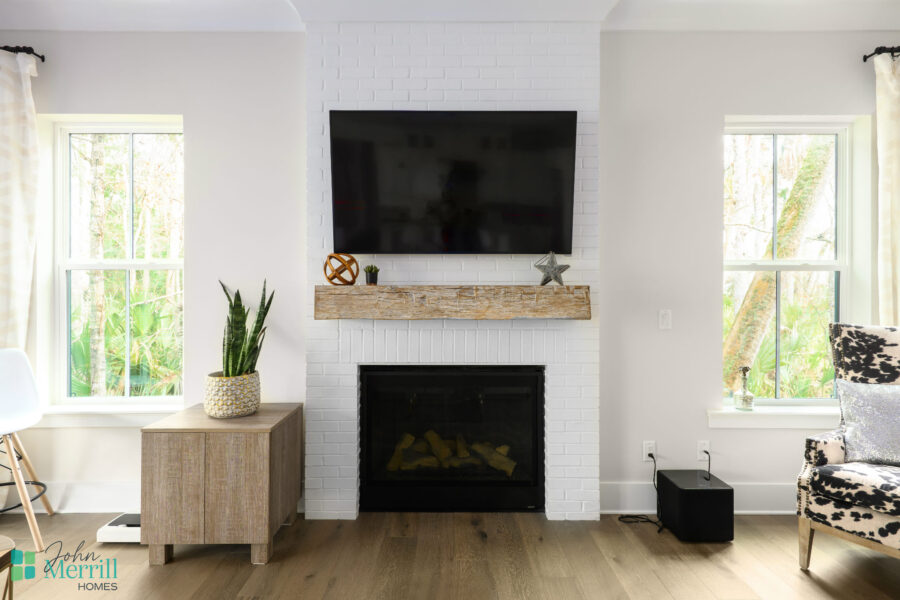 Bright living room with a modern fireplace and wall-mounted TV.