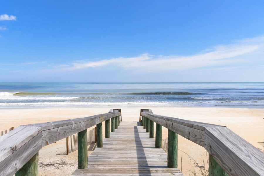 Is waterfront property a good investment? JMH waterfront home with deck looking to water and beach